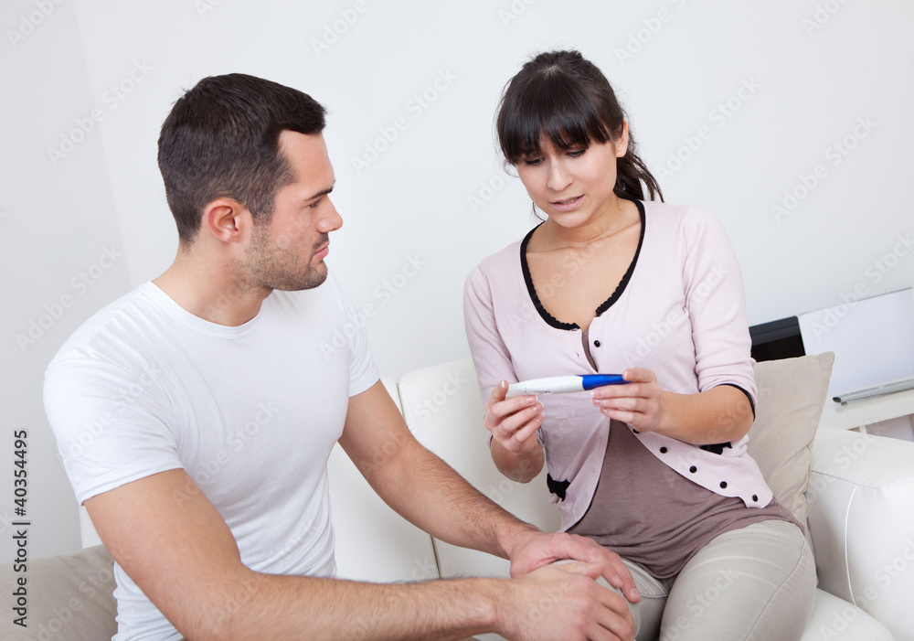 Couple finding out results of pregnancy test Couple finding out results of pregnancy test