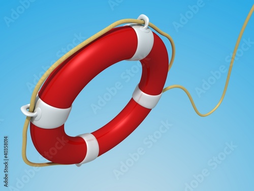 red Lifebuoy flying against the blue sky photo