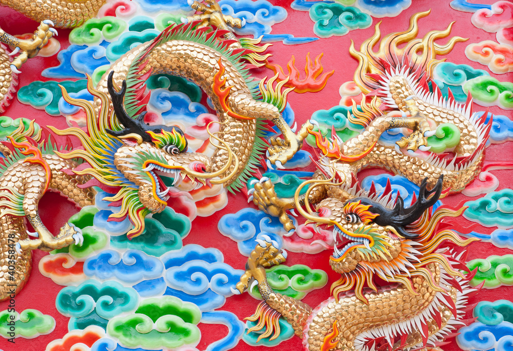 chinese dragon statue on temple wall in Thailand chinese dragon statue on temple wall in Thailand