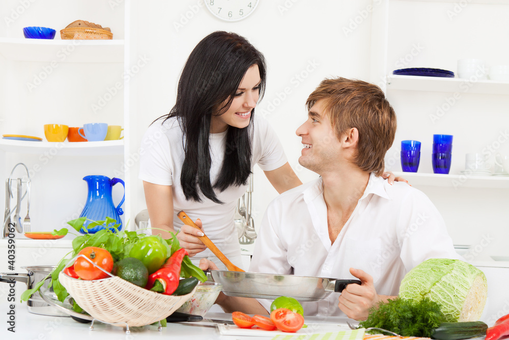 young couple in kitchen young couple in kitchen