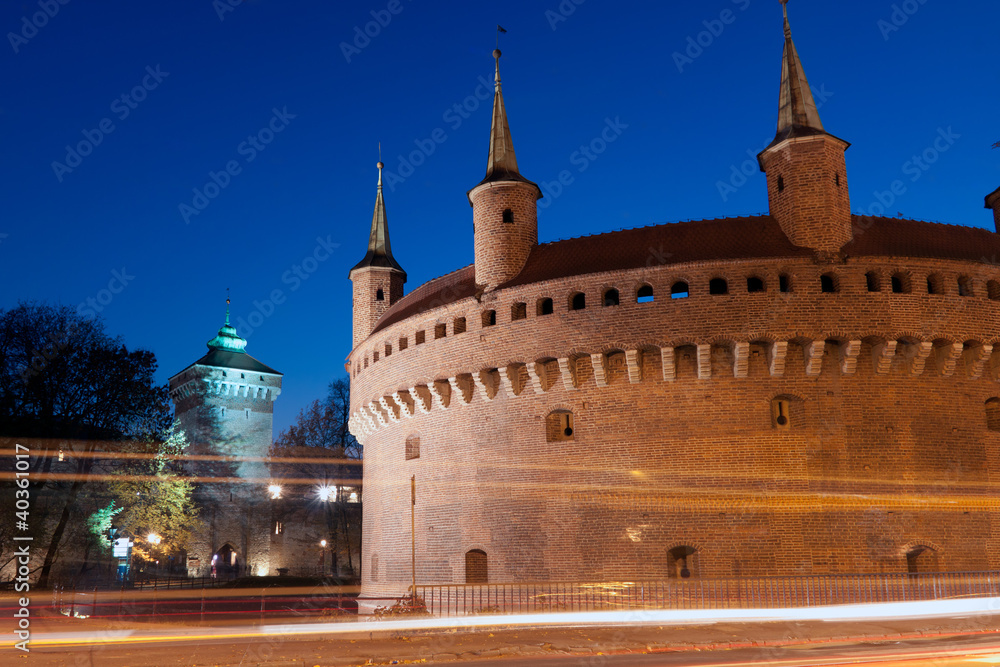 Obraz premium A gate to Krakow - barbican, Europe, Poland by night