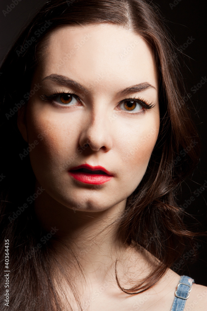 portrait of woman on dark background portrait of woman on dark background