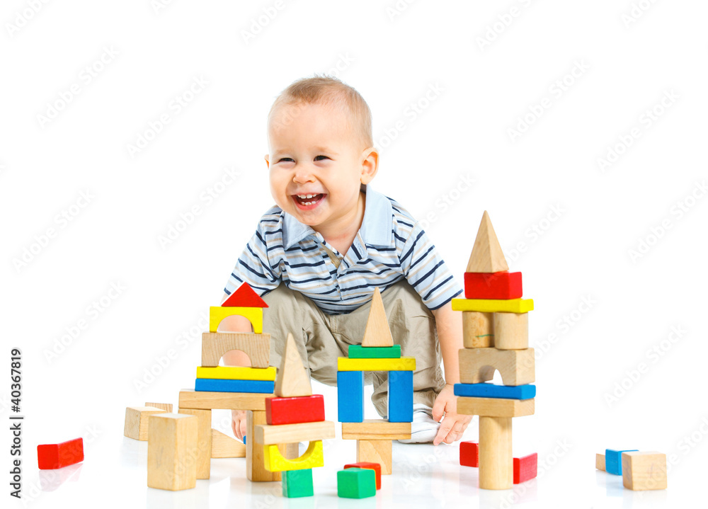 smiling little boy is building smiling little boy is building