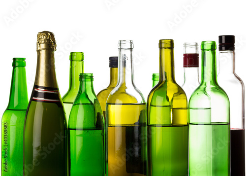 Different alcohol drinks bottles isolated on white