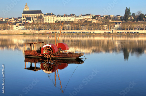 Vintage red boat with Blois cathedral photo