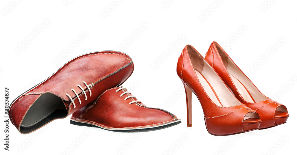 Male and female leather shoes isolated over white