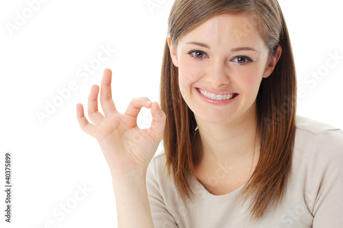 Portrait of happy smiling businesswoman with okay gesture
