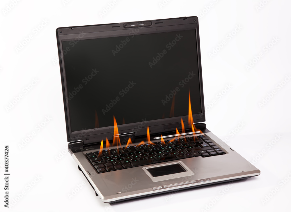 Laptop with flame on keyboard Laptop with flame on keyboard