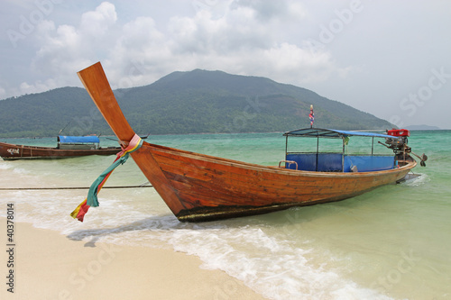 Boat at LI pe Island Thailand. © boonchob chuaynum