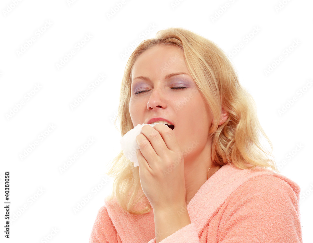 A young woman sneezing, isolated on white A young woman sneezing, isolated on white