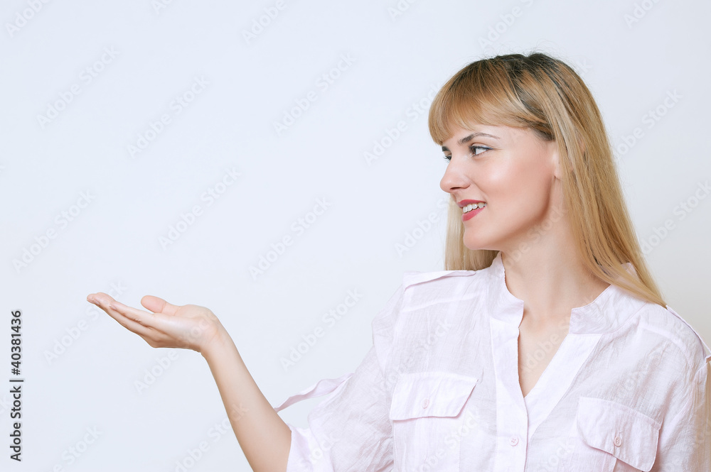 Happy smiling young beautiful business woman showing blank area Happy smiling young beautiful business woman showing blank area