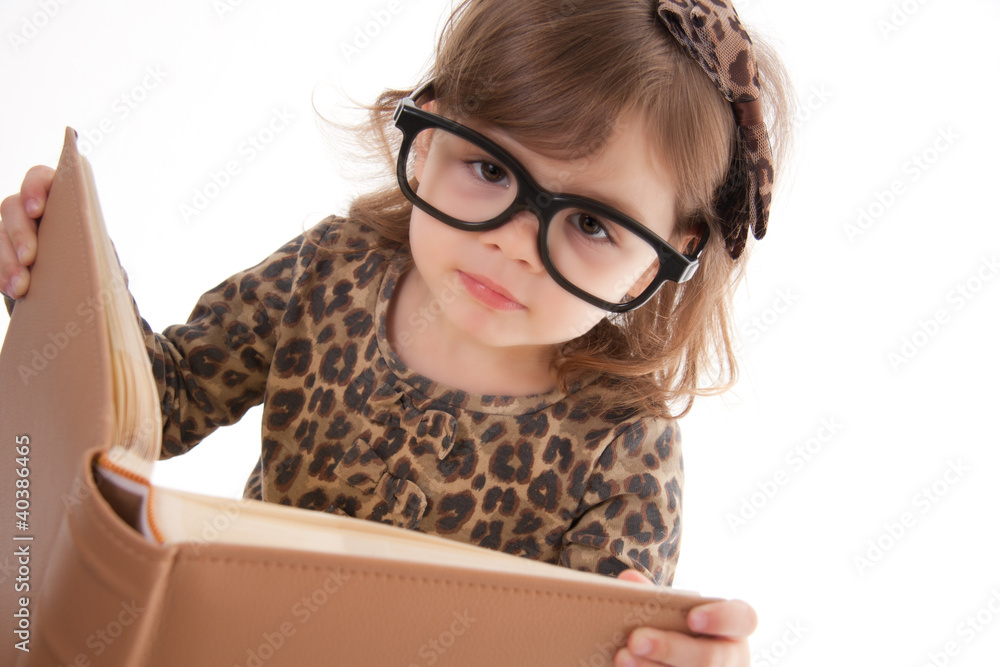 child reading a book, wearing large glasses child reading a book, wearing large glasses