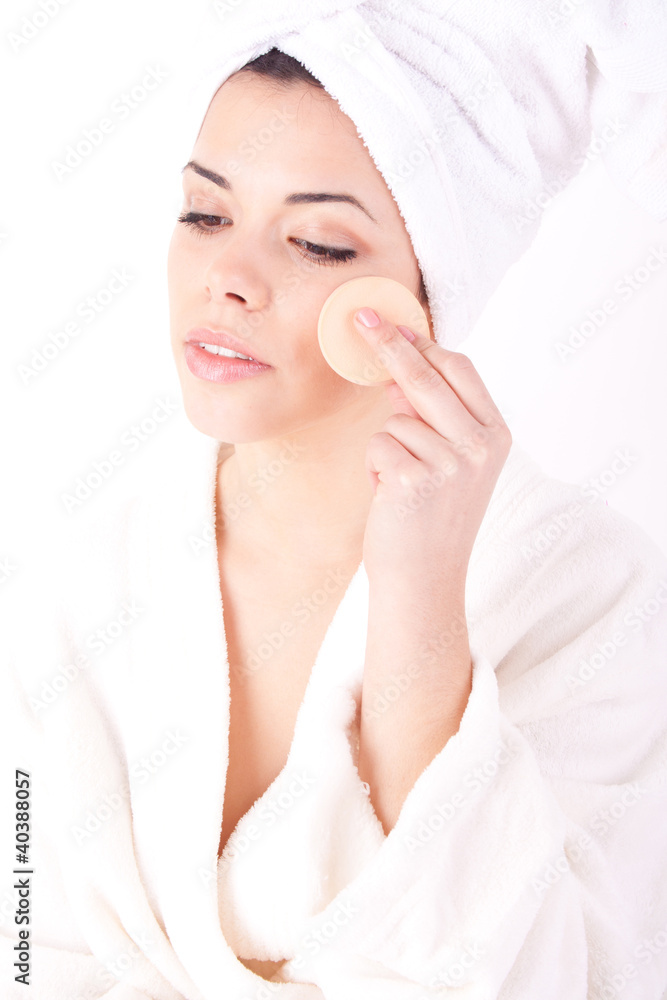 beautiful woman with perfect skin - Applying clean sponge. beautiful woman with perfect skin - Applying clean sponge.