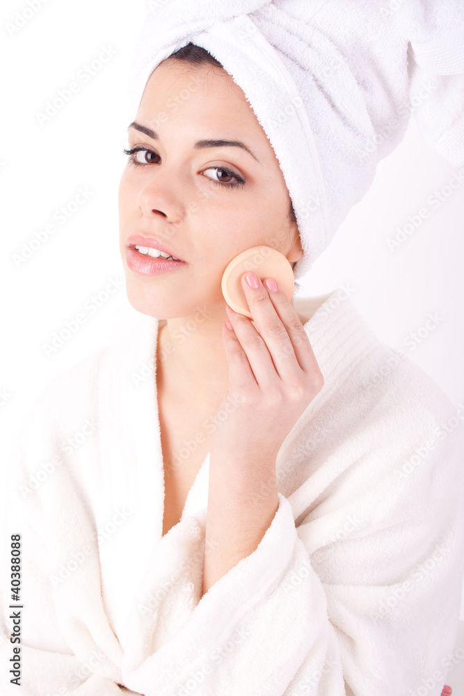 beautiful woman with perfect skin - Applying clean sponge. beautiful woman with perfect skin - Applying clean sponge.
