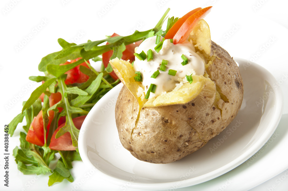 Baked potato filled with sour cream and arugula Baked potato filled with sour cream and arugula