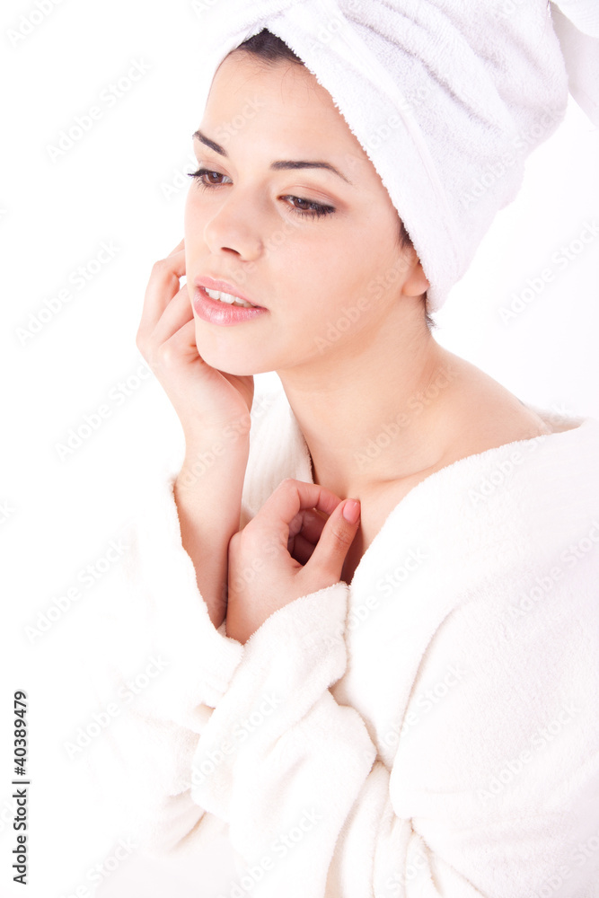 Beautiful healthy young brunette woman in a white spa bath robe