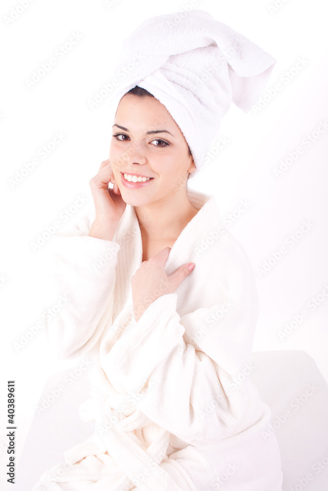 Beautiful healthy young brunette woman in a white spa bath robe Beautiful healthy young brunette woman in a white spa bath robe
