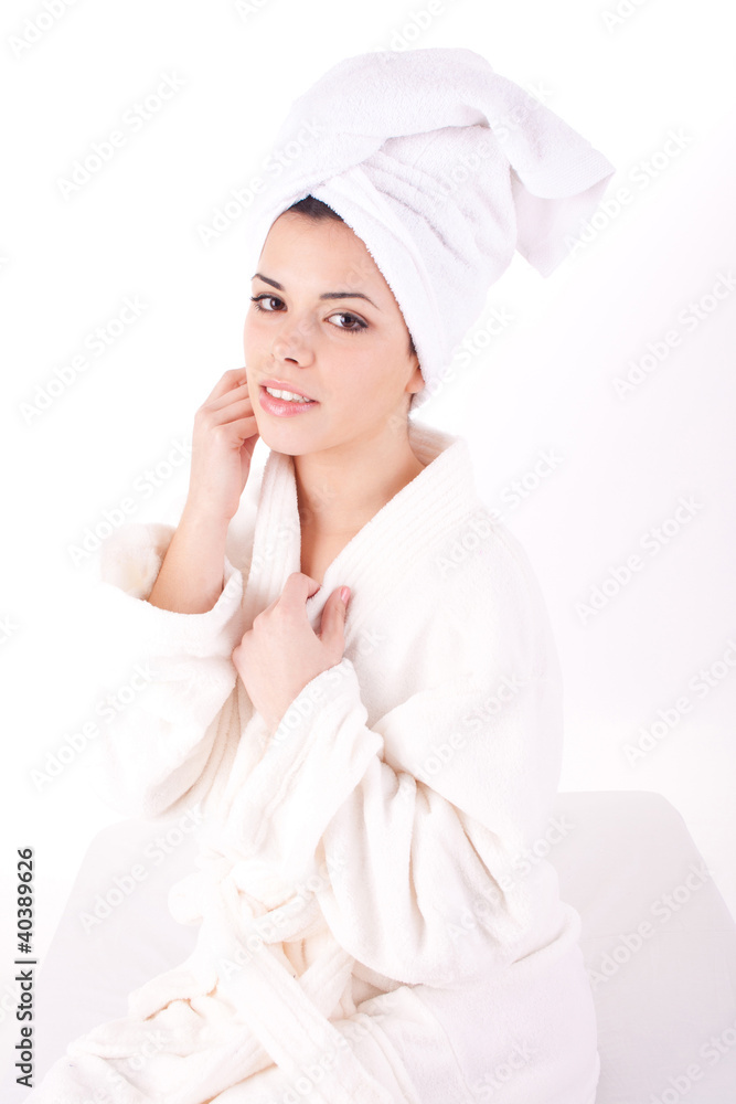 Beautiful healthy young brunette woman in a white spa bath robe Beautiful healthy young brunette woman in a white spa bath robe