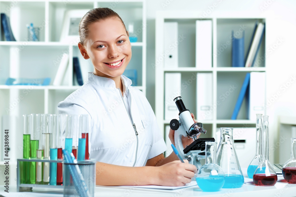 Young scientist working in laboratory Young scientist working in laboratory