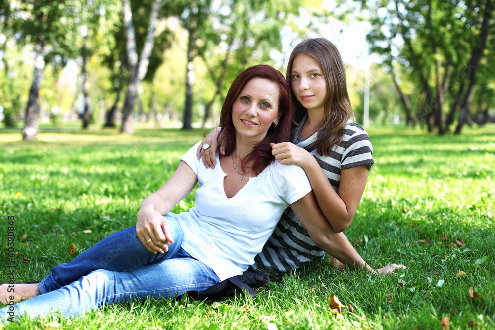 Mother with her daughter in summer park Mother with her daughter in summer park