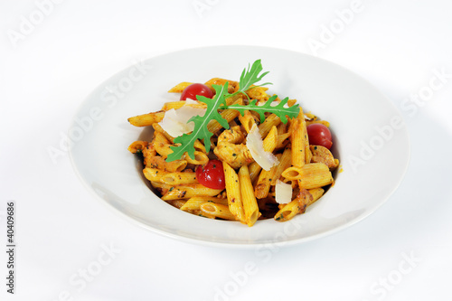 Penne alla vodka with chicken meat and salad rucola