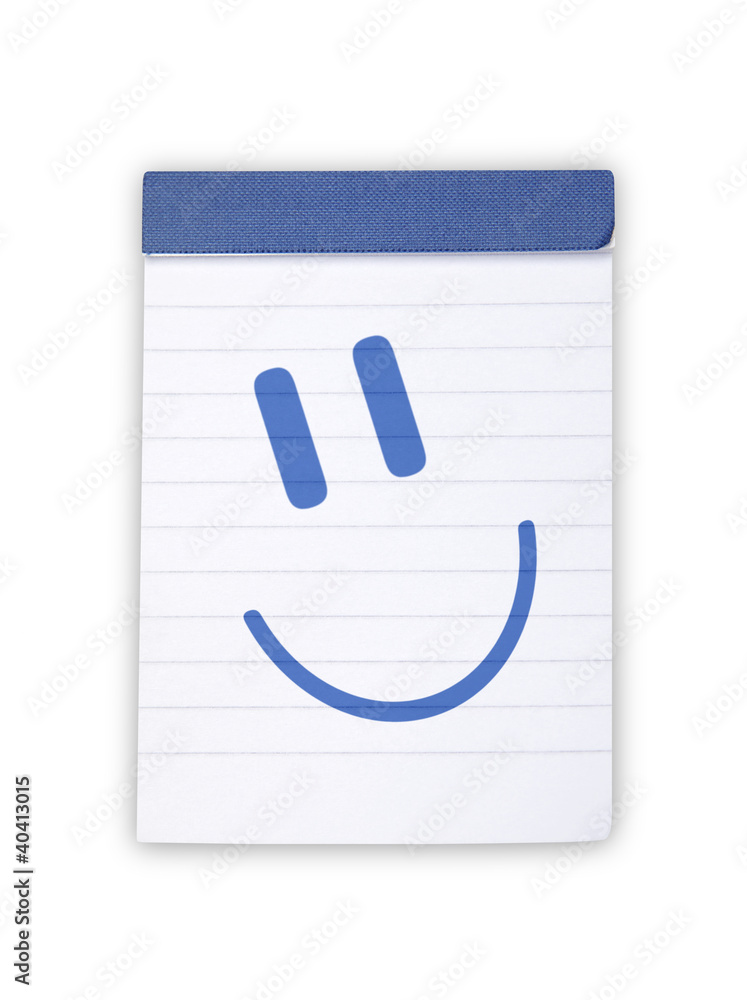 blue smiley on notepad blue smiley on notepad