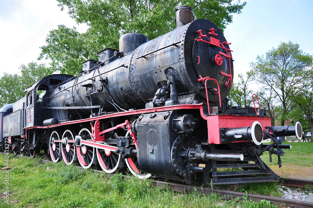 Naklejka premium black locomotive (train) on railway