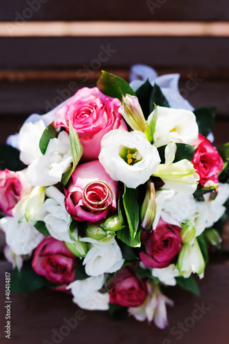 Beautiful wedding flowers bouquet with wedding gold rings