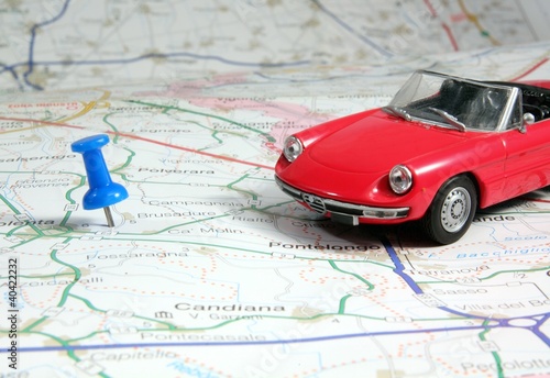 red spider car model on the road