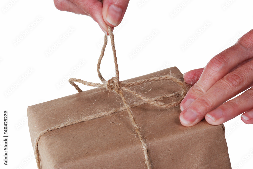 Obraz premium Untying string on a package