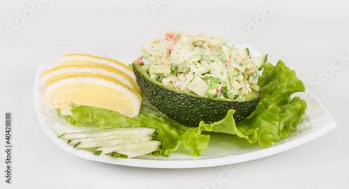 Crab meat salad with green caviar in avocado - japan cusine