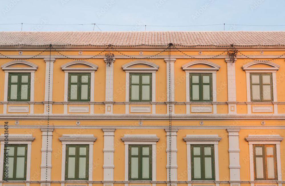 Fototapeta premium Old yellow building at dusk