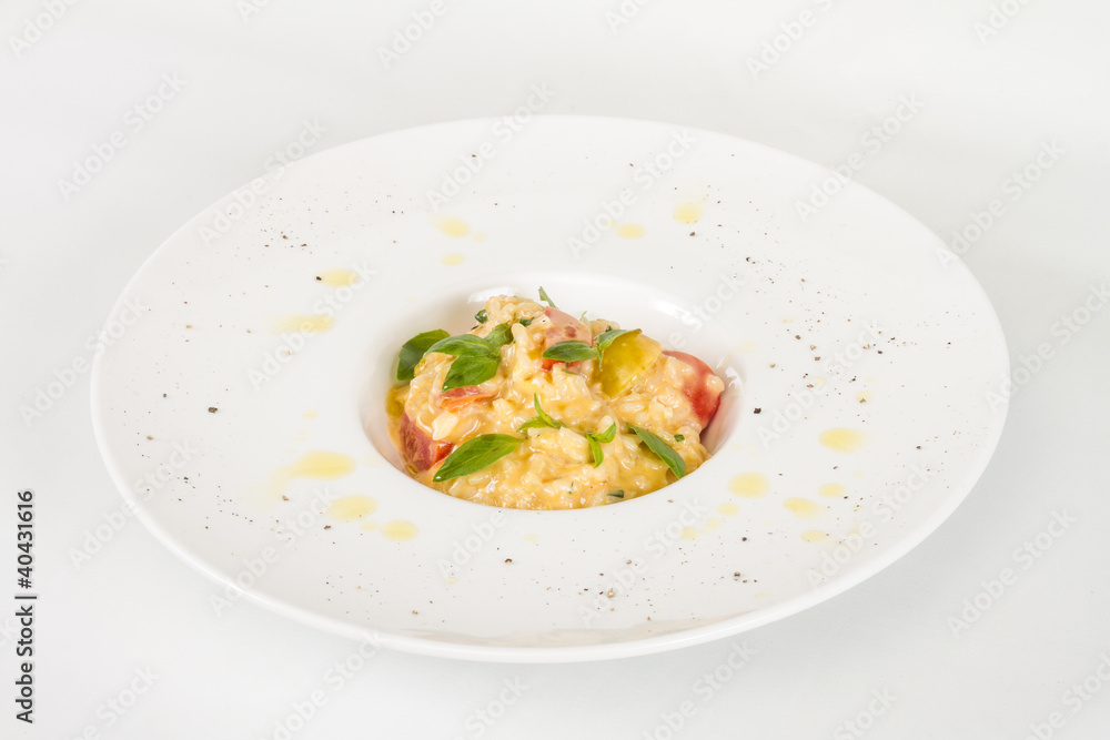 photo of delicious risotto dish with herbs and tomato on white b photo of delicious risotto dish with herbs and tomato on white b