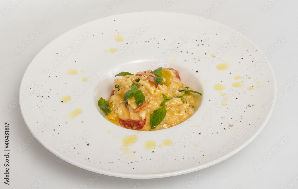 photo of delicious risotto dish with herbs and tomato on white b photo of delicious risotto dish with herbs and tomato on white b