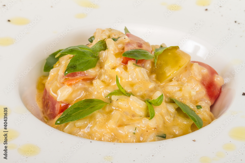 photo of delicious risotto dish with herbs and tomato on white b photo of delicious risotto dish with herbs and tomato on white b