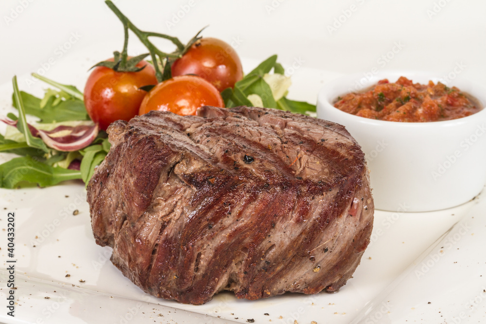 Grilled Beef Steak Isolated On a White Background Grilled Beef Steak Isolated On a White Background