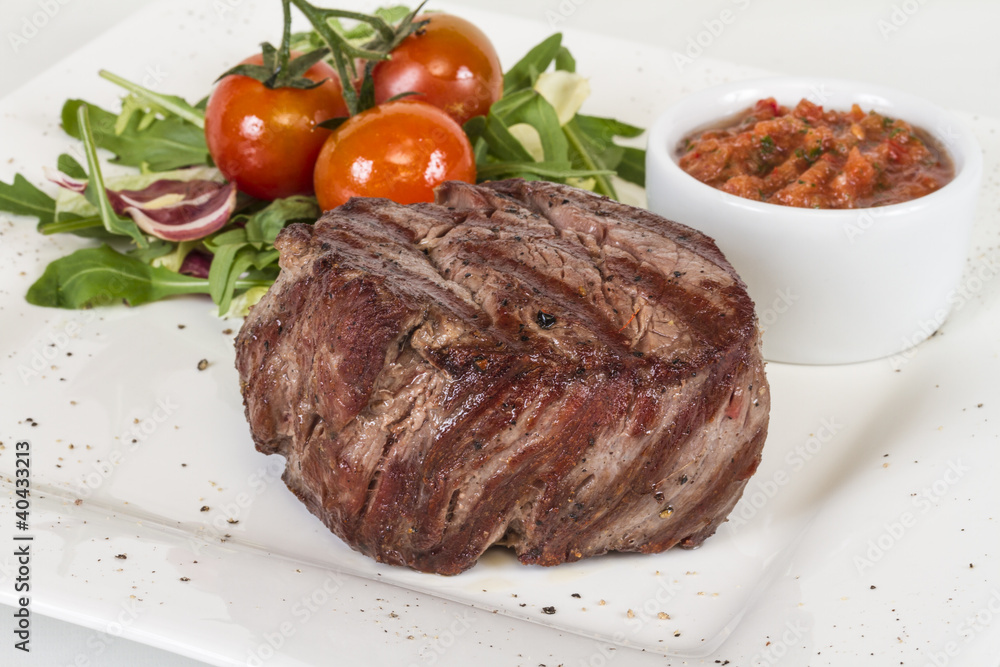 Grilled Beef Steak Isolated On a White Background Grilled Beef Steak Isolated On a White Background