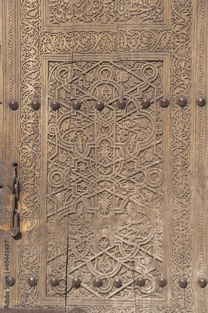Ancient wooden door in Khiva, Uzbekistan