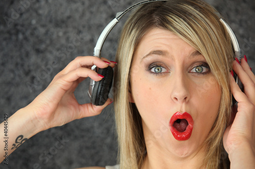 Фотография Woman listening to loud music