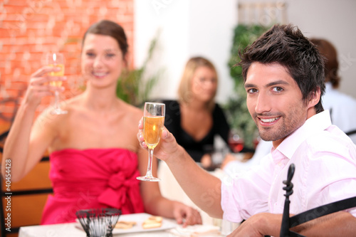 Couple toasting in restaurant