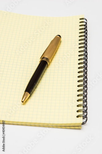 notebook and pen on a white background