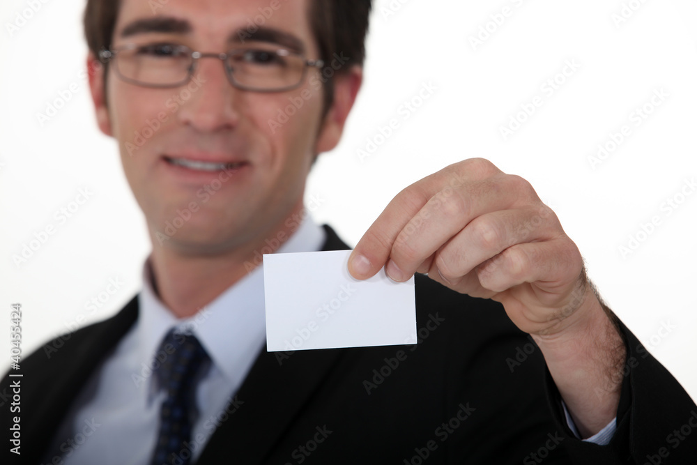 Executive with a blank business card Executive with a blank business card