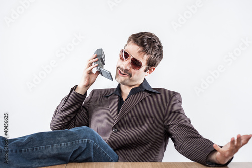 Young Business Man With Glasses on Mobile Phone