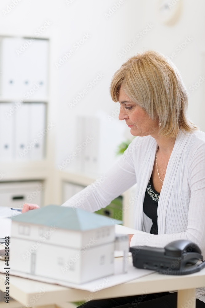 Middle age architect woman working at office Middle age architect woman working at office