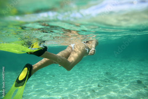 Closeup on snorkeler flippers underwater