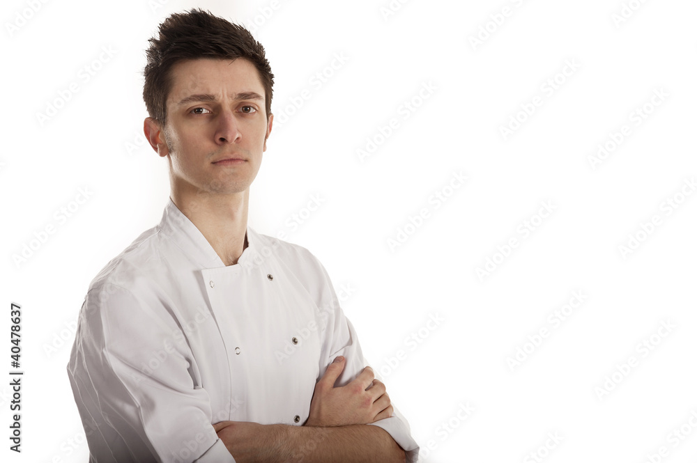 Chef wearing white jacket with folded arms Chef wearing white jacket with folded arms
