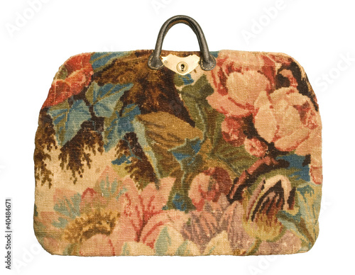 Antique carpetbag with a flower pattern photo