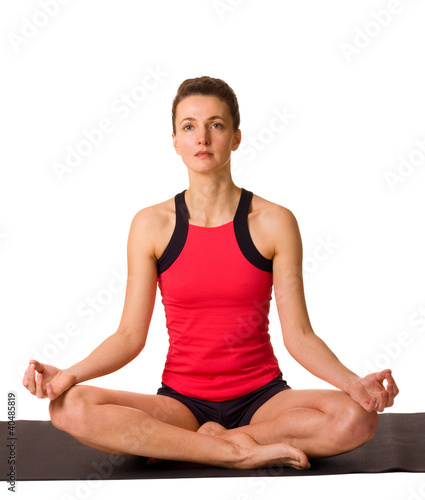 young woman doing yoga isolated on a white background.