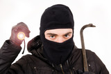 Thief with flashlight and crowbar, isolated in white