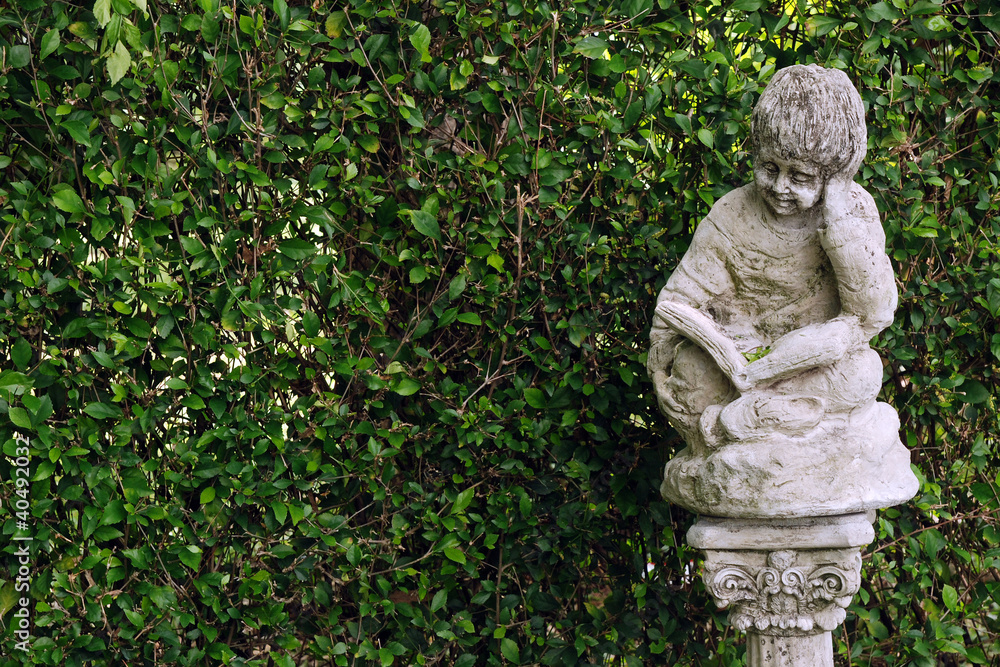 Ancient statues and leaves background